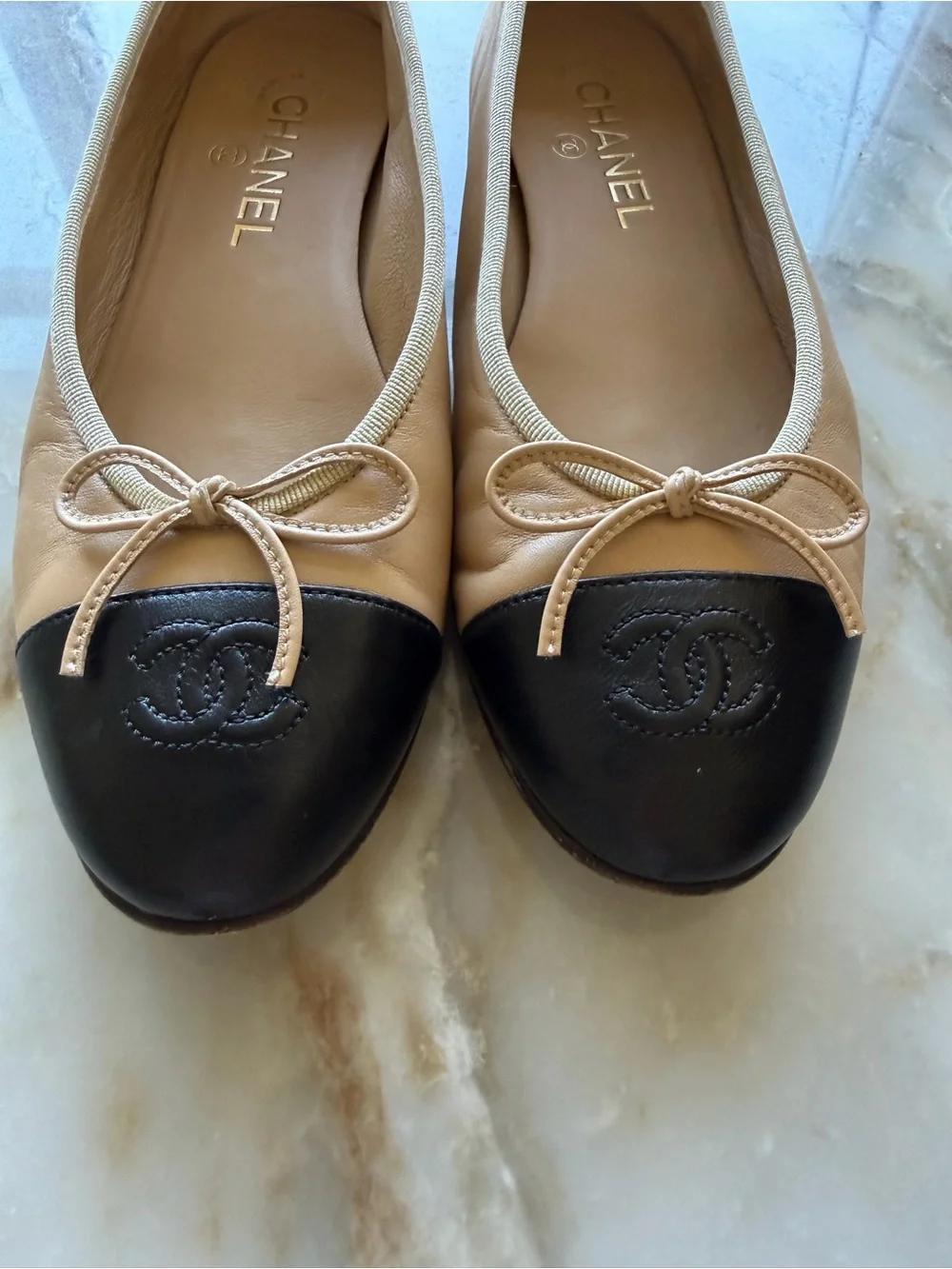 CHANEL Beige and Black Leather Cap-Toe Ballet Flats